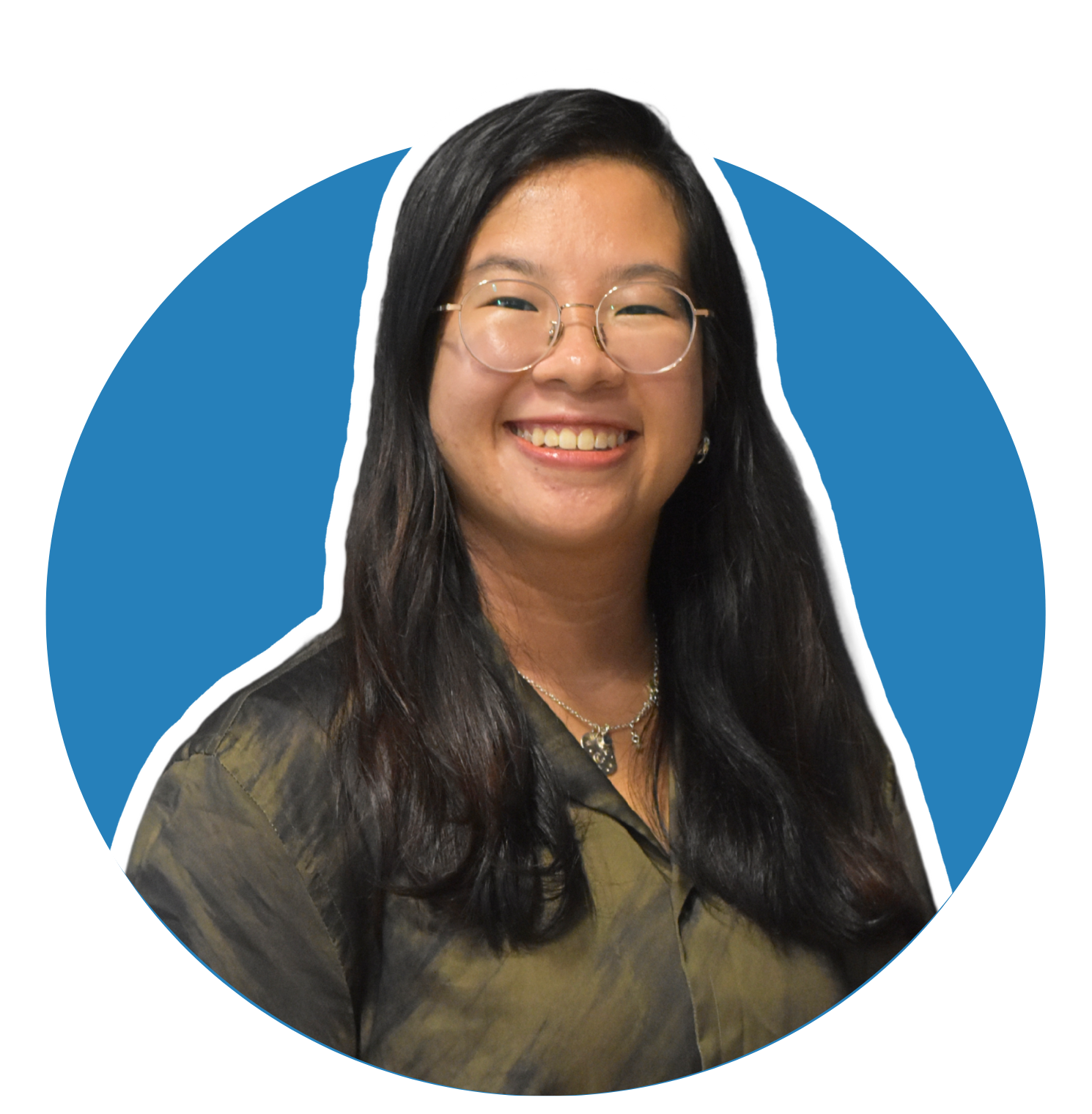 Clara's profile picture features a woman with long, straight black hair wearing glasses and a dark olive-green blouse. She is smiling warmly and looking directly at the camera. The background is a solid blue circle, giving the image a clean and professional look.