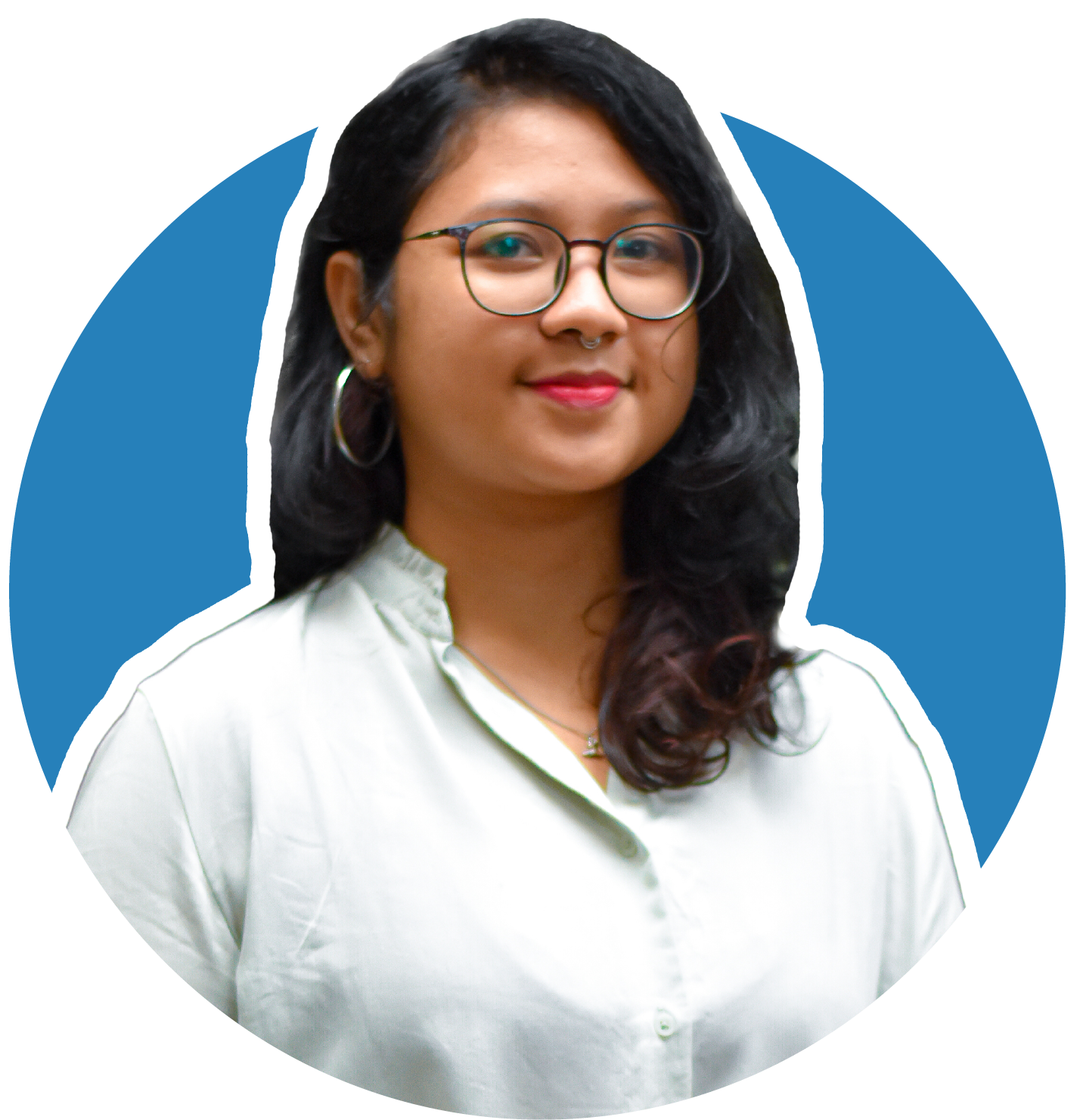 A headshot showing Lisa from the chest up. She has short, dark hair, and is wearing glasses and a dark, polka-dotted blouse. The background is a solid, medium blue circle. The image is professionally taken and styled for a professional context.